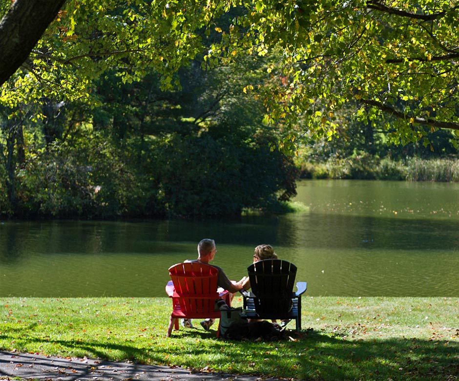 Guests Lounging Lakeside - Peaks of Otter Lodge