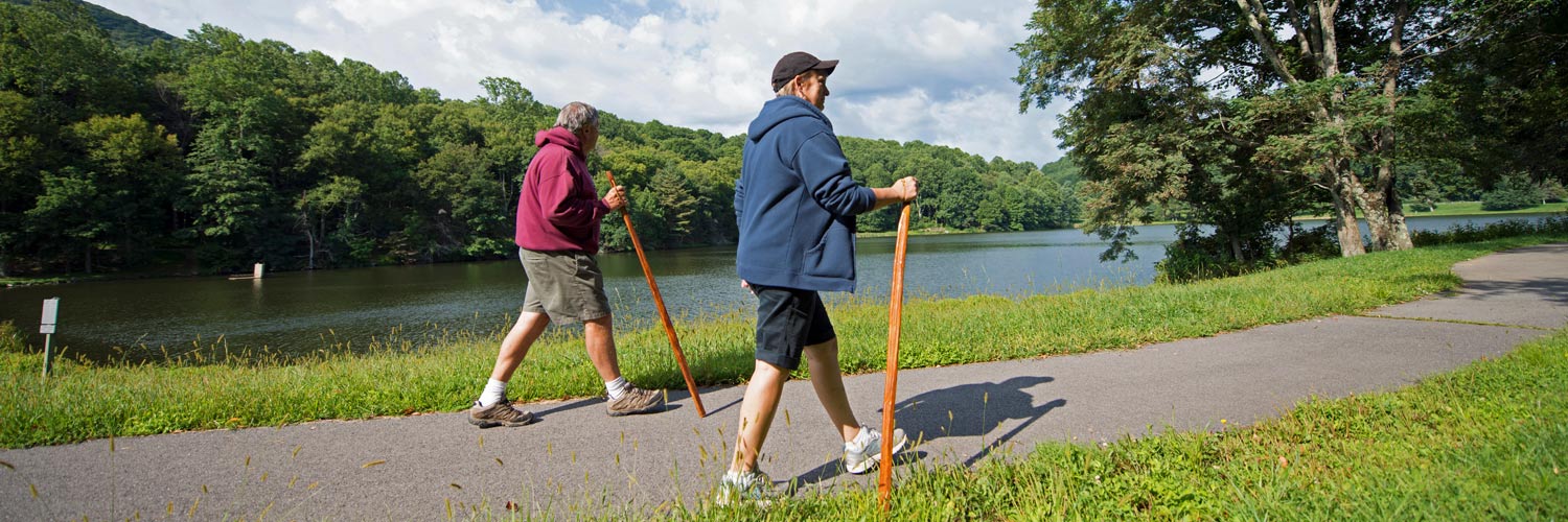 Two Peaks of Otter Lodge guests hiking on a nearby trail